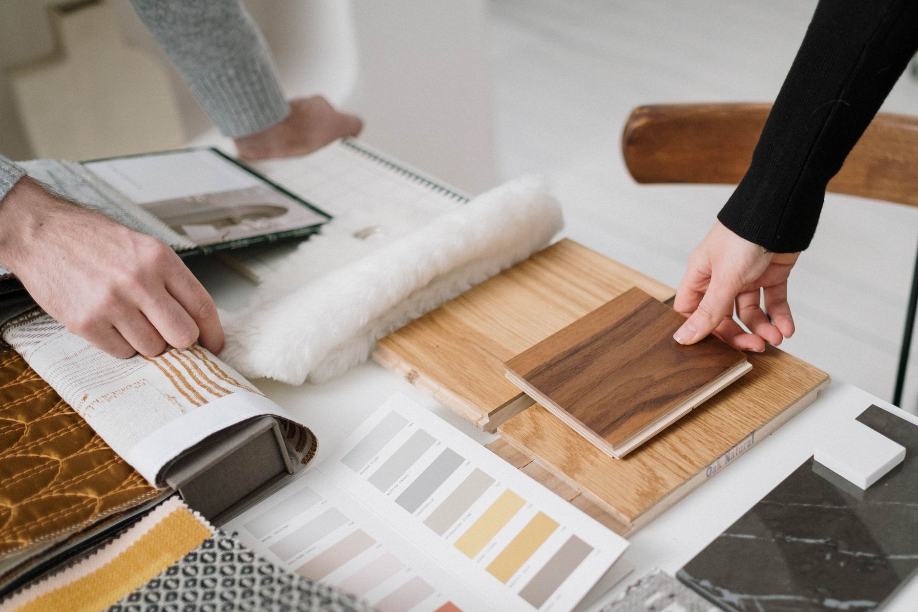 Vanguard interior designer selecting warm natural textures in Cairo studio