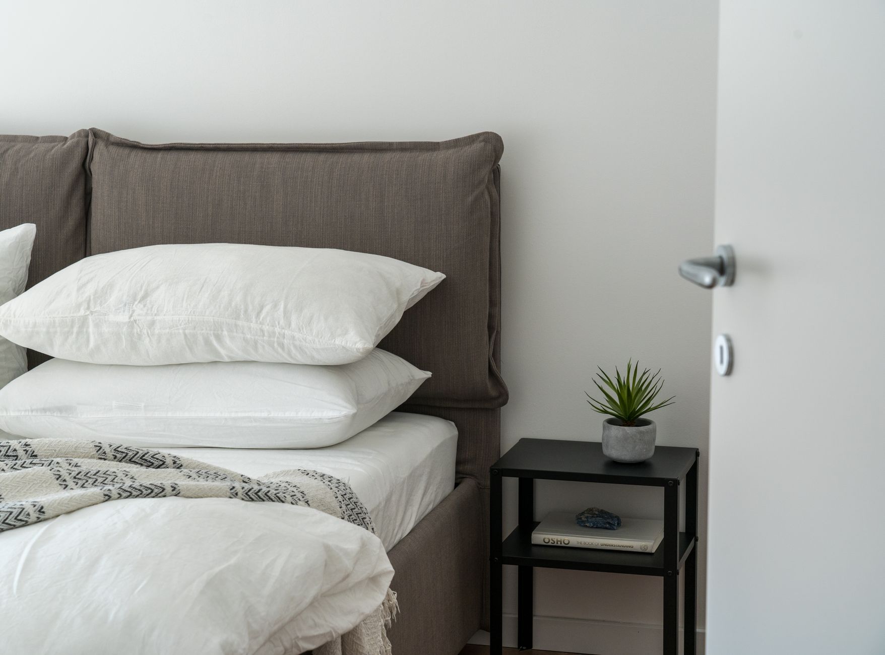 Luxury master bedroom with warm linen textures